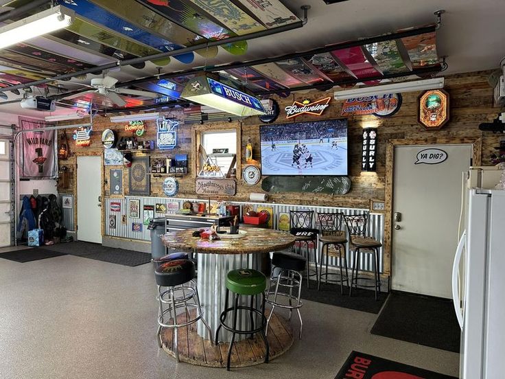 the inside of a garage with lots of memorabilia on the walls and ceiling, including an ice rink