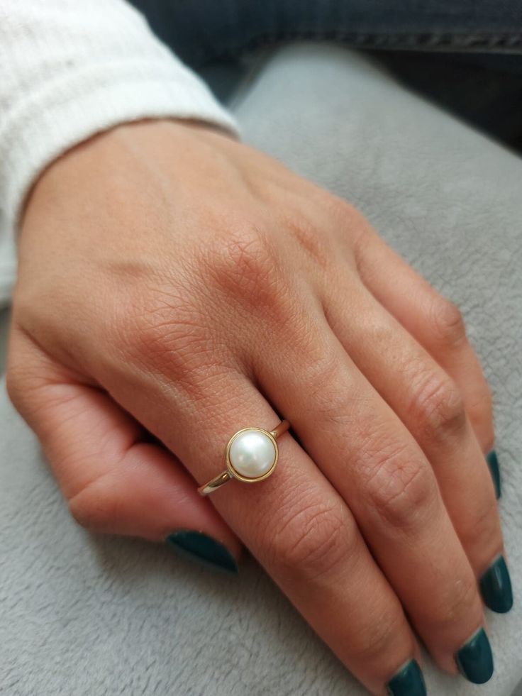 Pearl Solid Gold ring. This handmade gold engagement ring with Pearl is made of 14K genuine gold and set with pearl This 14 karat gold ring can serve as an engagement ring or a birthday gift, bridesmaid. * Gemstone -Natural pear pearl size: Pearl 8 mm round * Metal - 14K genuine gold . * Beautifully packaged, ready for gift giving. I make all my items with care and professionalism which I learnt from my father and grandfather. I am 4 generation of jewelers and all my knowledge can be seen in my Real Pearl Ring, Minimalist Pearl Rings For Formal Occasions, Minimalist Formal Round Pearl Ring, Formal Gold Pearl Rings, Formal Minimalist Round Pearl Ring, Minimalist Formal Pearl Ring, Classic Pearl Drop Promise Ring, Classic Promise Ring With Pearl Drop, Classic Yellow Gold Rings With Pearl Drop