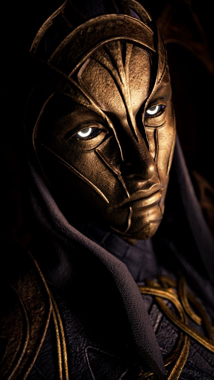 a close up of a person wearing a mask with blue eyes and gold details on their face