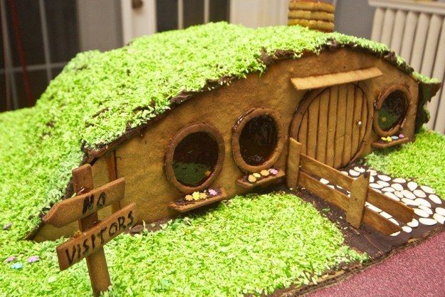 a cake made to look like a hobbot house with moss growing on it