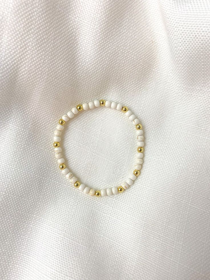 Howlite Bracelet - Tacklebox Everyday White Beaded Bangle Bracelet, Pearl White Round Beads Jewelry For Everyday, Dainty Stretch Bracelet With 8mm Beads, Trendy Pearl White Round Bead Jewelry, Dainty White Jewelry For Everyday, Trendy Pearl White Beaded Jewelry, Trendy Adjustable Beige Jewelry, Dainty White Everyday Jewelry, White Stackable Bracelets As Gift