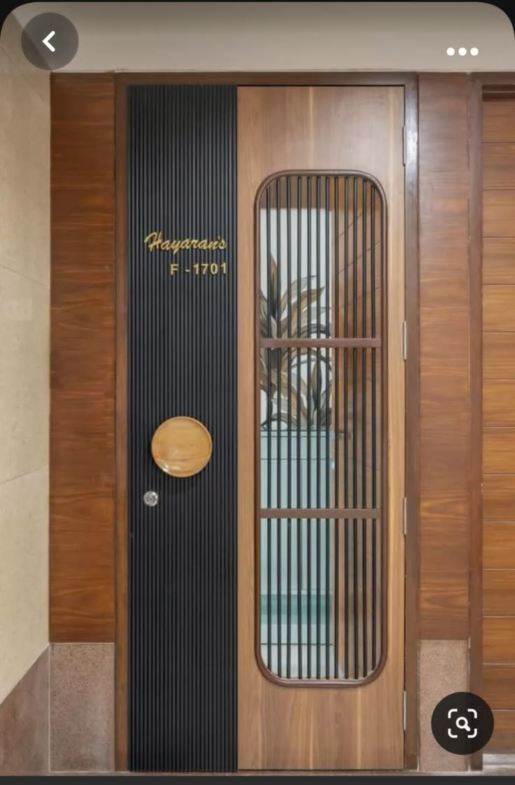 a wooden door with a glass paneled front and side panels on the outside wall