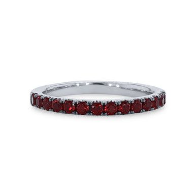 a white gold band with red stones