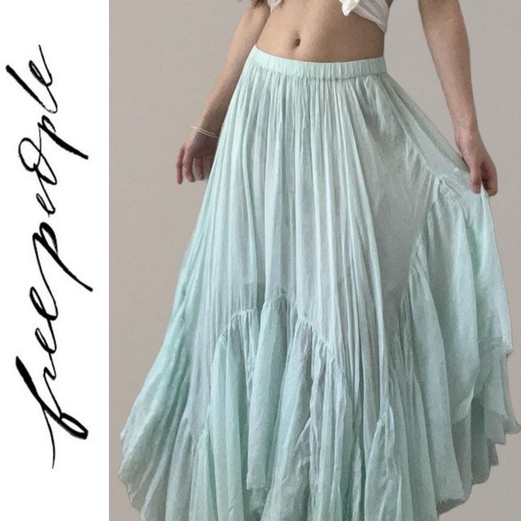 Free People Fp One Clover Skirt Nwot Sizes: Xs Waist: 13" Flat Lay (Elastic Waist, Stretches To 16") Length: Approx 44" At The Longest Point Of The Staggered Handkerchief Hem Med Waist: 14" Flat Lay (Elastic Waist, Stretches To 18") Length: Approx 44" At The Longest Point Of The Staggered Handkerchief Hem Perfectly Crafted, This Stunning Skirt Will Turn Heads With Every Wear. Fit: Mid-Rise, Billowy A-Line Silhouette Features: Pull-On Design, Pieced Tiered Trimming, Asymmetrical Handkerchief, Hem Spring Breezy Flared Maxi Skirt, Breezy Summer Flared Skirt Bottoms, Breezy Flared Maxi Skirt For Spring, Breezy Summer Flared Skirt, Breezy Flared Skirt For Summer, Breezy Blue Bottoms For Spring, Breezy Long Skirt For Summer, Breezy Skirted Bottoms For Spring, Light Blue Long Skirt For Spring