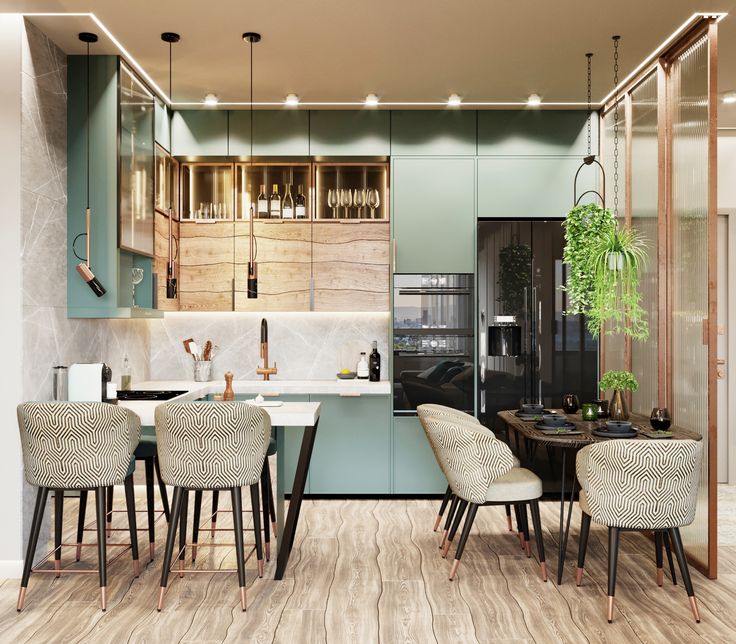 a kitchen with wooden floors and green walls, white counter tops and chairs in front of an island