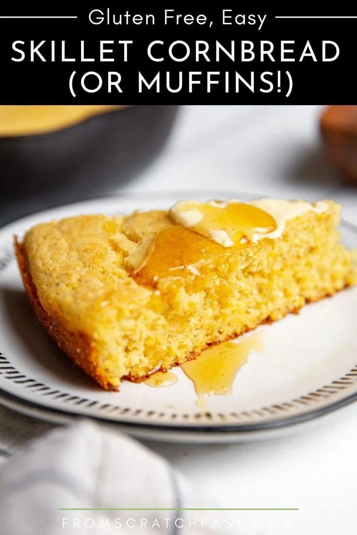 a slice of cornbread on a plate with butter and syrup drizzled over it