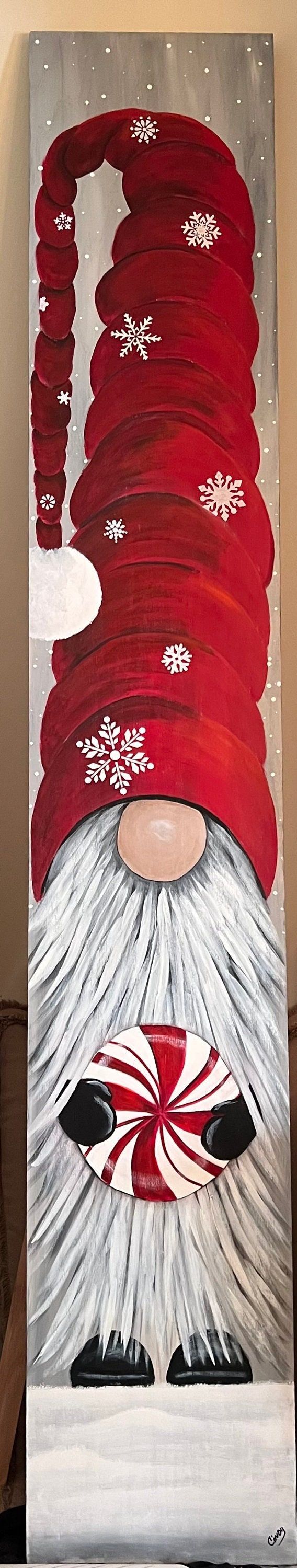 a painting of a santa claus with red and white stripes on his face, standing in front of a wall