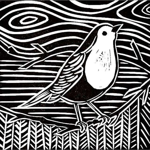 a black and white drawing of a bird on a branch