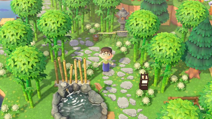 an animal crossing game in the middle of a forest with trees and rocks on it