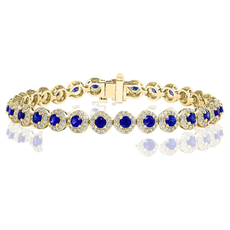 Add color to your style with this gorgeous Blue Sapphire bracelet. Features 29 Round cut blue sapphires surrounded by a single row of sparkling 377 round diamonds in a halo setting. Sapphires and diamonds weigh 4.67 carats and 1.57 carats total respectively. Made in 14-karat yellow gold. All diamonds are GH color SI1 Clarity. Available in Ruby and Emerald as well. Style is available in different price ranges. Prices are based on your selection. Don't hesitate to get in touch with us for more information. Blue Sapphire Bracelet, Bracelet Tennis, American Modern, Halo Setting, Sapphire Bracelet, Tennis Bracelet Diamond, Sapphire Diamond, Tennis Bracelet, Blue Sapphire