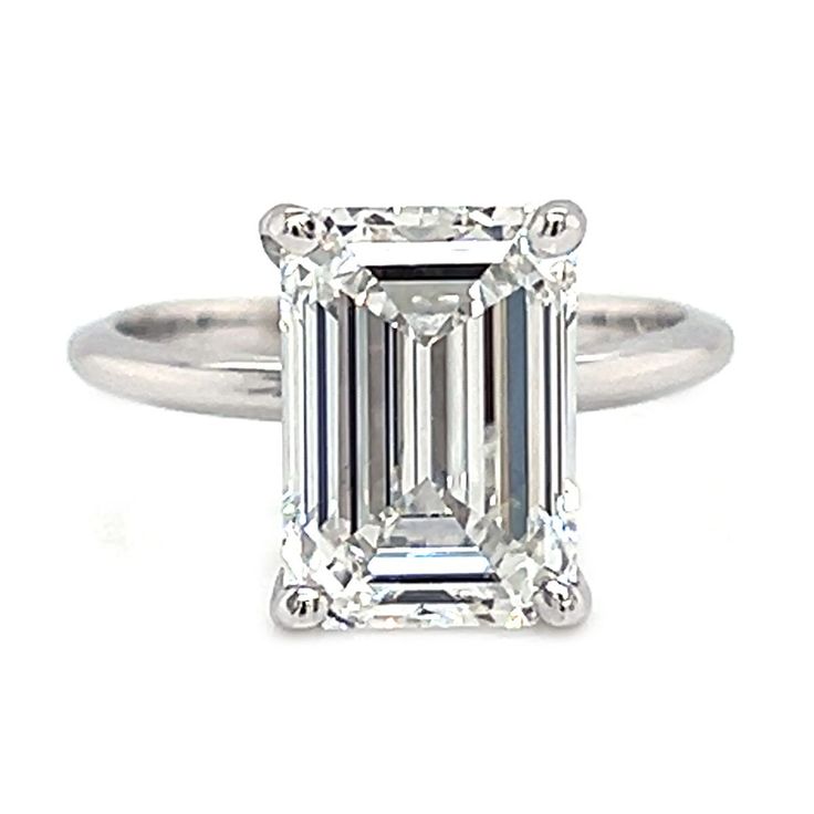 This exquisite diamond is a IGI Certified 4.15 ct. Lab Created Emerald Cut Diamond featuring colorless white F color and eye clean VS1 clarity. This magnificent diamond is set on this 14 kt. White Gold Solitaire mounting. We can make this ring in her exact finger size, just let us know and your ring will arrive ready to place on her finger. White Platinum Diamond Ring Fine Jewelry, Classic 14k White Gold Radiant Cut Ring, White Radiant Cut Rings Fine Jewelry, Emerald Cut White Diamond Ring, White Emerald Cut Diamond Ring, White Radiant Cut Lab Grown Diamond Ring, White Radiant Cut Fine Jewelry Ring, White Diamond Ring With Baguette Cut, White Moissanite Diamond Cut Ring