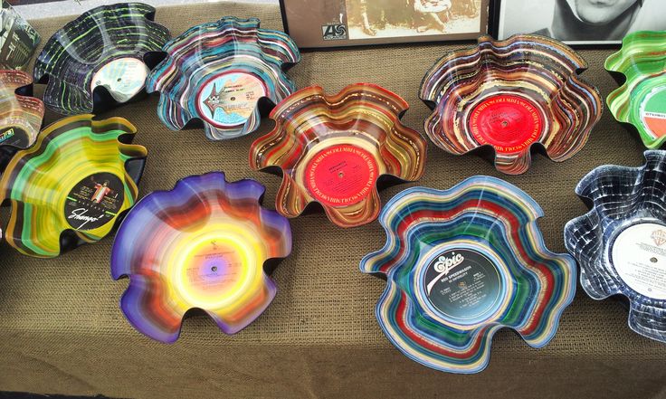 many colorful glass bowls are on the table