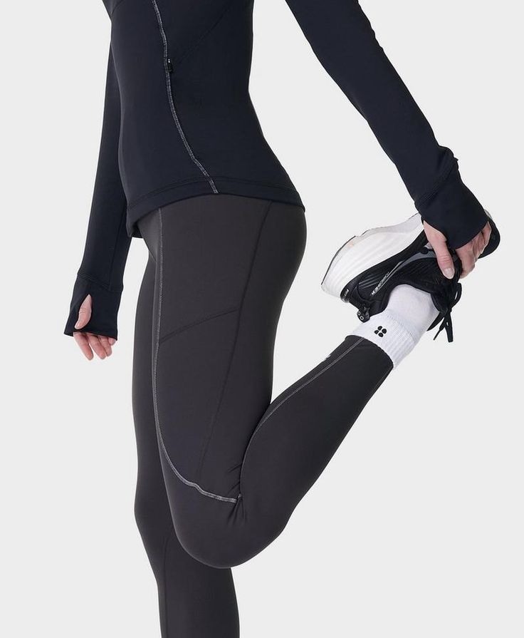 An updated version of our bestselling winter run leggings. Updated 78% recycled fabric is stretchy and sweat-wicking

. Part of our innovative HeatProtect collection with a ‘Base’ rating for temperature-regulating and sweat-wicking protection in all elements. Brushed, fleece-feel lining and high elasticated waist that stays put as you move. Two side pockets, one back zip pocket and reflective seam detailing. Inseam length: 27" / 68cm. Model wears size S and is 178cm/5'10" tall. Style Code: SB990 Functional Activewear With Thumbholes And 4-way Stretch, Functional Activewear With Thumbholes, Compression Activewear With Thumbholes For Running, Winter Sports Leggings Made Of Elastane, High Stretch Go-dry Athleisure Pants, Compression Pants With Ribbed Waistband For Workout, Functional Breathable Stretch Bottoms, Breathable Stretch Functional Bottoms, Breathable Stretch Bottoms For Functional Wear