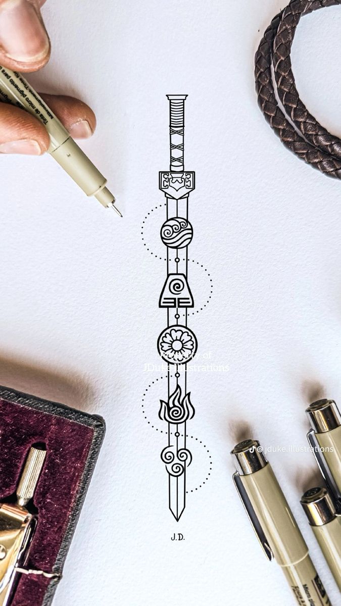 a drawing of a tall tower on top of a white paper next to some pens