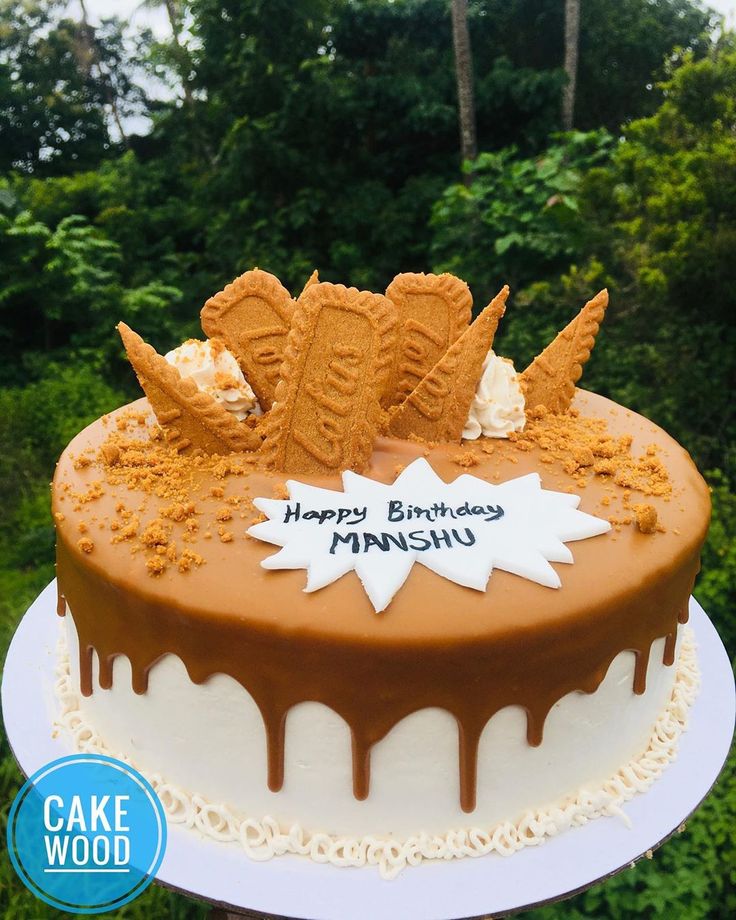 a birthday cake with frosting and decorations on it