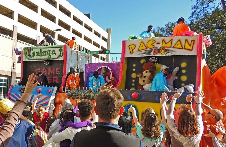 a parade with people dressed in costumes and clowns