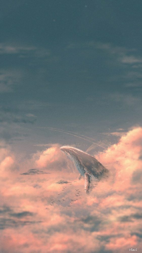 a bird is flying through the clouds in the sky