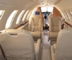 the inside of an airplane with leather seats