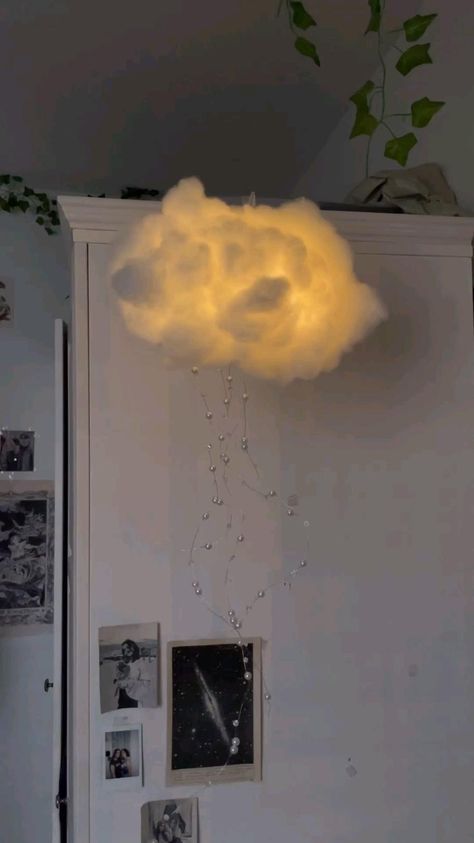 a cloud is floating in the air above a refrigerator