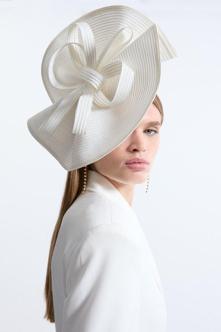 Get Dressed Up And Finish The Look With A Fascinator, With A Structured, Wavy Style Design And Bow Detailing, Fitted Onto A Comfortable Headband. Styles Perfectly With A Dress Or Pantsuit In Matching Tones For A Look Ideal For Wedding Guest Days And Days At The Racecourse. Wavy Loop Fascinator Unique, Wavy Design Three Dimensional Bow Accent Statement, Large Size Chic Fitted Fascinator For Church, Classic White Fascinator, Fitted White Fascinator For Ceremony, White Fitted Fascinator For Ceremony, White Bow Hat For Kentucky Derby, White Hat With Bow For Kentucky Derby, Chic White Hat With Bow, Beige Fitted Fascinator For Ceremony, Fitted Beige Fascinator For Ceremonies