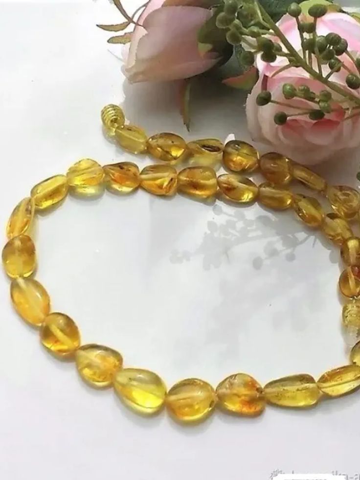 Baltic Amber Choker Necklace Honey Yellow Beads Necklace Short Healing Energy Necklace Amber Jewelry for Women Gemstone beaded necklace handmade oval natural amber beads Yellow Gemstone Jewelry 15.70 inches - 40 cmBeautiful necklace made of sunny honey amber bead necklace In such amber necklace made of natural warm amber you will feel cozy and protected addition, amber is a strong protector necklace from negative energy necklacebrings positive emotions and cheers up, just looking at a sunny amber jewelry improves mood.Baltic Amber is a good comforter, relieving difficult experiences and inspiring hope for a happy future.Psychics see the spirit of amber in the form of a wise and kind old man, so the energy of the stone is very calming and pacifying.The stone heals the soul, teaches to be ca Yellow Beads Necklace, Amber Jewelry Necklaces, Yellow Gemstone Jewelry, Energy Necklace, Happy Future, Large Bead Necklace, Amber Bead Necklace, Honey Yellow, Natural Gemstone Necklace