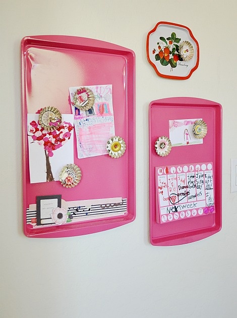 a pink magnetic board with magnets and pictures on it that says paint old cookie sheets and create magnet boards