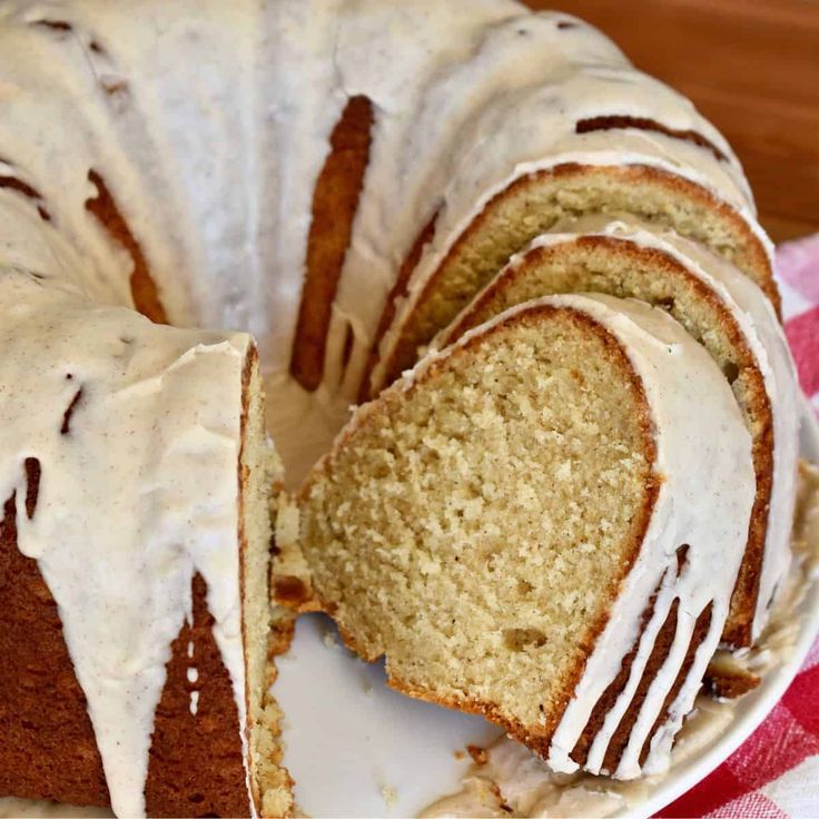 a bundt cake with white icing on a plate