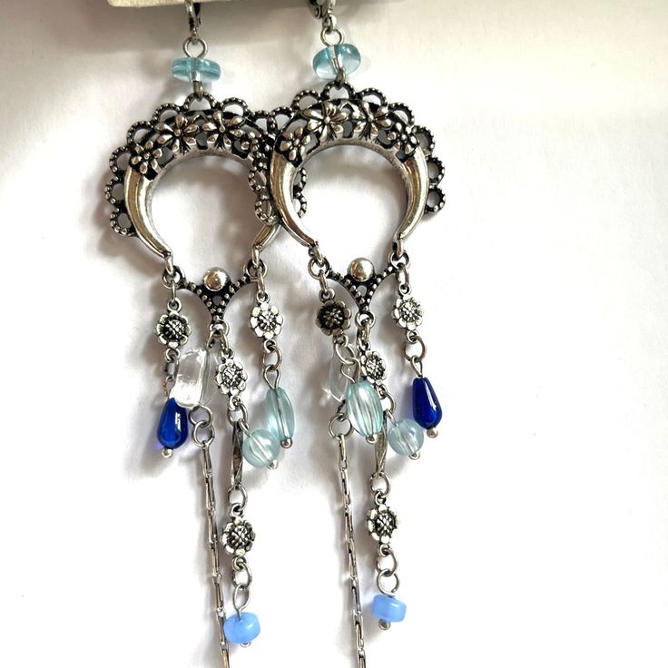 Measurements- Please See Photo. Blue Bohemian Metal Earrings, Blue Bohemian Crystal Earrings, Bohemian Blue Crystal Earrings, Bohemian Blue Metal Earrings, Blue Metal Crystal Earrings, Blue Crystal Metal Earrings For Pierced Ears, Blue Metal Chandelier Earrings For Pierced Ears, Blue Drop Earrings With Dangling Charms, Blue Metal Earrings With Dangling Beads