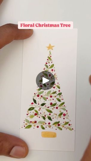 someone holding up a christmas tree card with the word floral christmas tree written on it