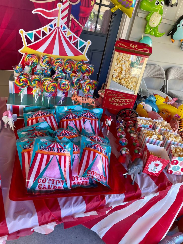 a carnival themed table with candy and candies