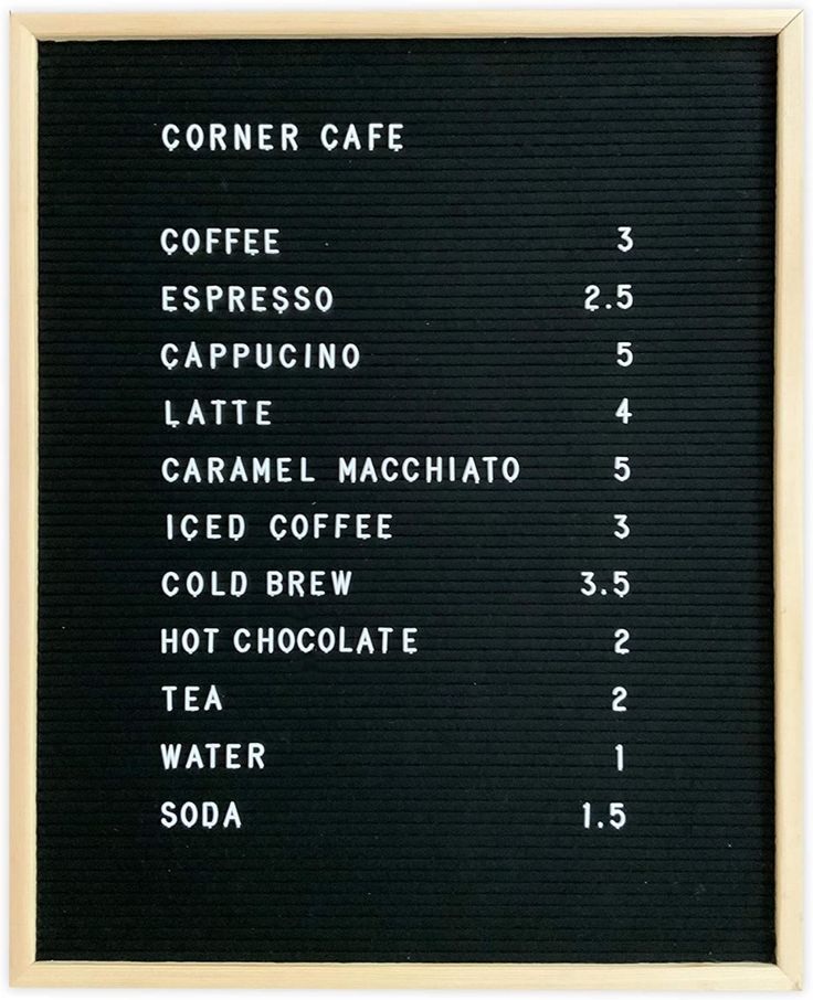 a menu for coffee is displayed on a black board with white writing and numbers below it