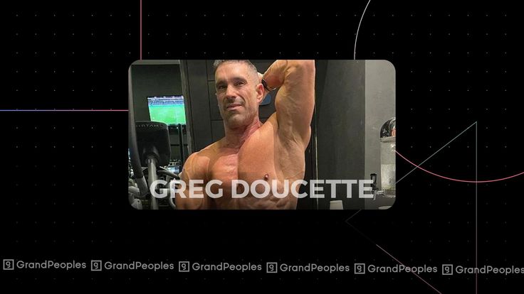 a man flexing his muscles in front of a tv screen with the words grec doucette on it