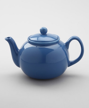 a blue teapot with a lid and handle is shown on a white background, it appears to be empty