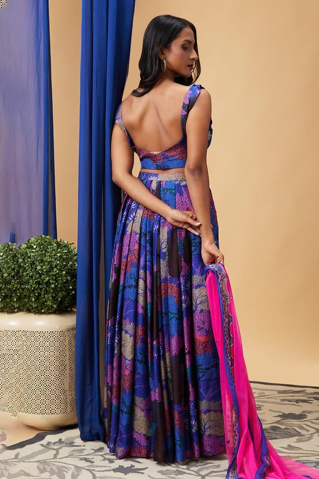 Blue silk lehenga with floral print and sequins embroidery. Comes with a blouse and a net dupatta.
Components: 3
Pattern: Printed, Embroidered
Type Of Work: Floral, Sequins
Neckline: V Neck
Sleeve Type: Sleeveless
Fabric: Silk, Dupatta: Net
Color: Blue
Other Details: 
Attached lining
Approx Product Weight: 1 Kg
Occasion: Sangeet - Aza Fashions Blue Silk Lehenga, Floral Print Lehenga, Silk Lehenga, Net Dupatta, Silk Dupatta, Sequins Embroidery, Fabric Silk, Blue Silk, Set For Women