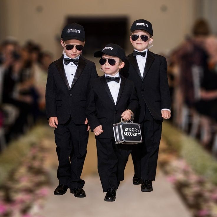 three little boys dressed in black suits and hats