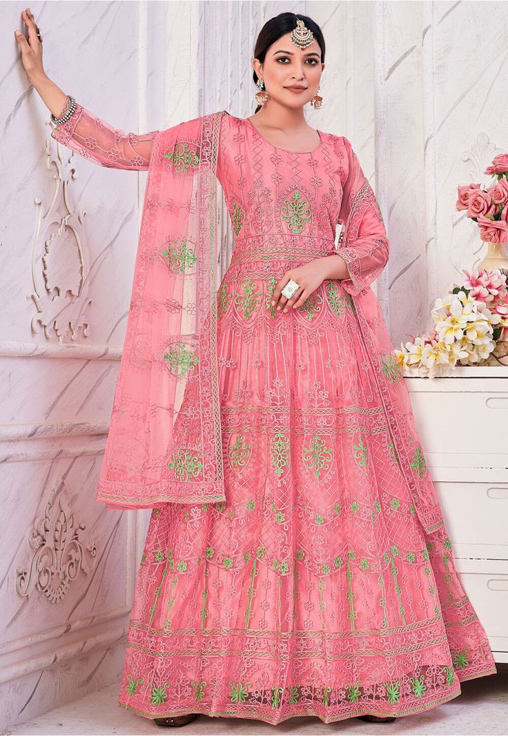 Net Abaya Style Kameez in Pink This Semi-stitched attire with Poly Shantoon Lining is Enhanced with Resham Work. Carved in Round Neck and Quarter Sleeve Available with a Poly Shantoon Pant in Pink and a Net Dupatta in Pink The Kameez and Bottom Lengths are 54 and 38 inches respectively Do note: Accessories shown in the image are for presentation purposes only and length may vary upto 2 inches.(Slight variation in actual color vs. image is possible). Pink Anarkali Suits, Net Anarkali, Indian Suits For Women, Suit Salwar, Resham Work, Embroidered Anarkali, Abaya Style, Eid Outfits, Elegant Outfit Classy