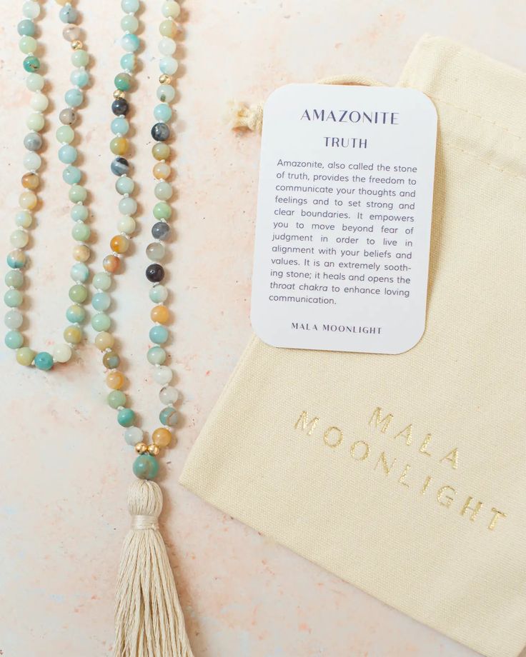 This Mala Beads Necklace is hand-knotted with Amazonite crystals and features 14K Gold-filled accent beads and a handmade cotton tassel. Hand-knotted traditional style This piece has the traditional 108 beads Bohemian 108 Beads Mala For Blessing, Holistic Hand Knotted Jewelry For Rituals, Bohemian Mala With 108 Beads For Blessing, Adjustable Spiritual Tassel Necklace With Natural Stones, Bohemian Necklaces With 8mm Beads For Rituals, Bohemian Hand Knotted Necklace For Rituals, Spiritual Tassel Necklace With 108 Round Beads, Adjustable Tassel Necklace With Natural Stones For Gift, Adjustable Bohemian Mala For Blessings