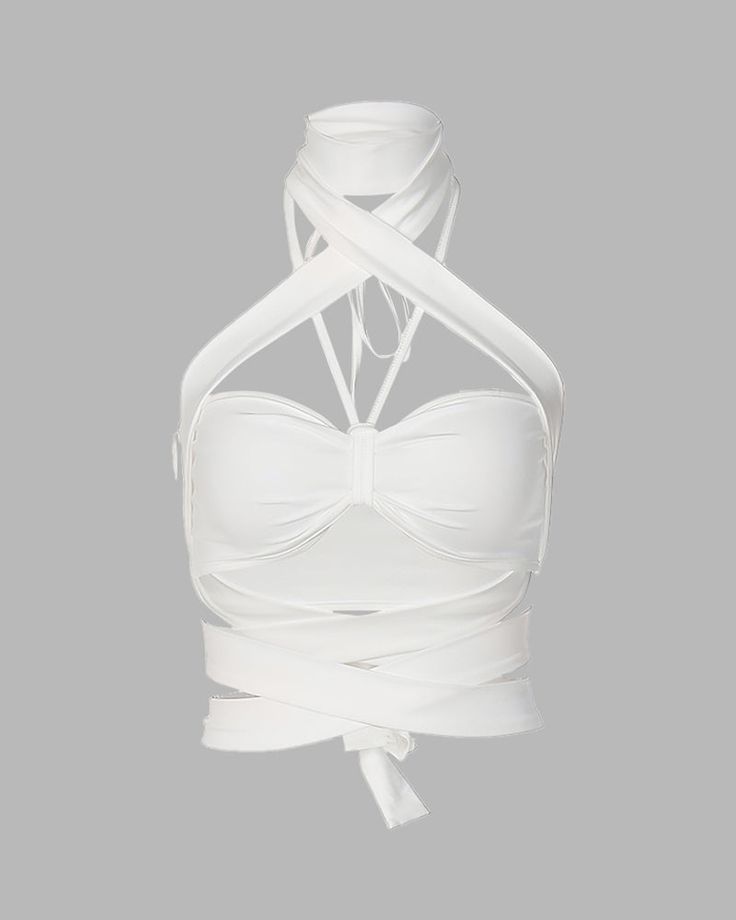 Details: Crop halter top with bandage style wrapping designLength: CroppedSleeve Length: SleevelessMaterials: 95% Cotton + 5% Spandex Stretch Sleeveless Cross-tied Halter Top, White Backless Halter Top With Straps, Fitted Strappy Top With Crisscross Straps, Summer Stretch Bandage Halter Top, Stretch Crisscross Cross-tied Halter Top, Stretch Cross-tied Crisscross Halter Top, Chic Fitted Halter Top With Wrap-around Straps, Fitted Summer Halter Top With Bandage Detail, Fitted White Halter Top With Crisscross Straps