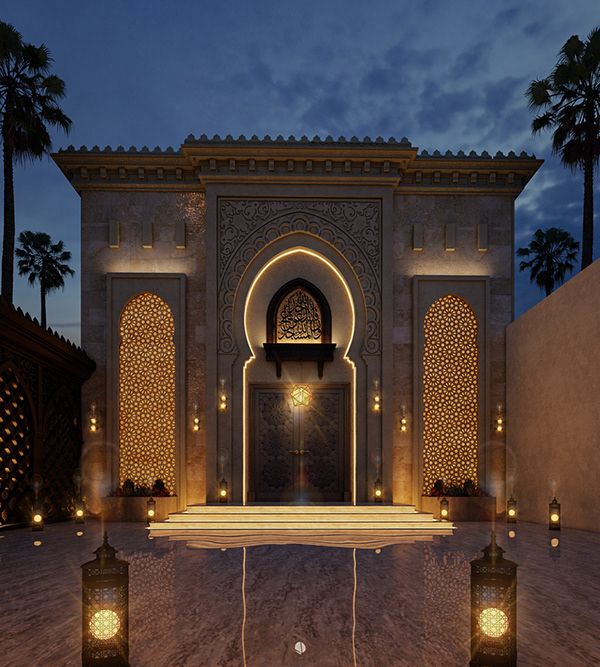 an entrance to a building with lanterns lit up in the night sky and palm trees around it