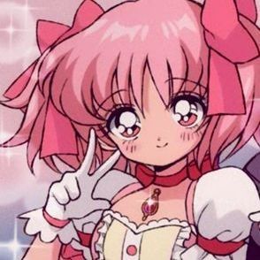 an anime character with pink hair and big eyes pointing to the side while standing in front of another character