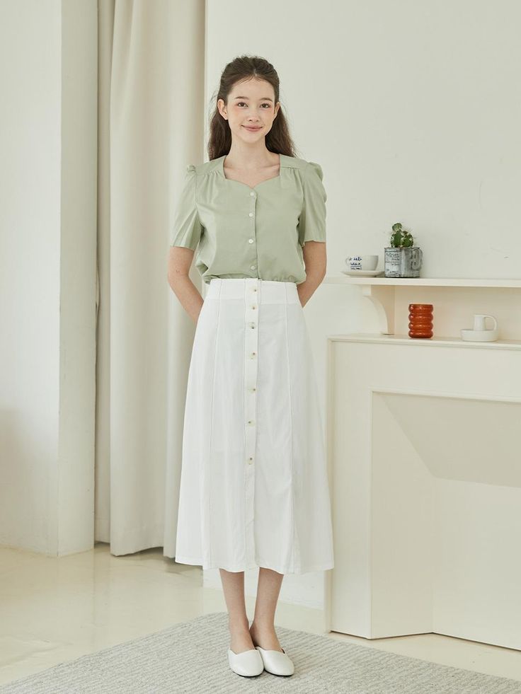 Editor's NotesThe Shirring Heart Neck Half Blouse is a lovely feminine top that is sensual for the heart-shaped neckline that pairs well when dressed with high-waisted midi-length skirts or short slacks for a fresh yet charming look for the upcoming season. - Button closure- Heart-shaped neckline- Short sleeve- Shirring detailMeasurements(in.)One size (XS-M)- Total length: 25.59 in.- Shoulder: 14.17 in.- Chest: 19.69 in. - Sleeve length: 10.24 in.*Model info: Height 5’8” / Bust 30 in. / Waist 25 in. / Hip 31 in.Composition & Care- 100% Tencel- Dry cleanDesigner- by BIBYSEOB Knee-length Summer Blouse, Midi And Top, Feminine Top, Half Sleeve Blouse, Midi Length Skirts, Pink Blouse, Half Sleeve, Half Sleeves, Midi Length