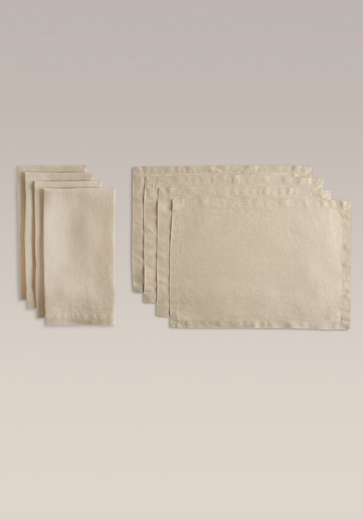 four napkins and one cloth on a table