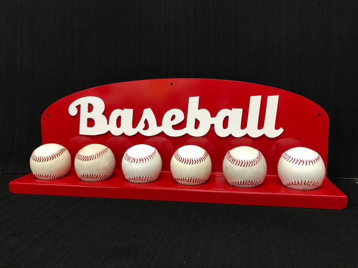 a red sign with six baseballs on it and the word baseball written in white