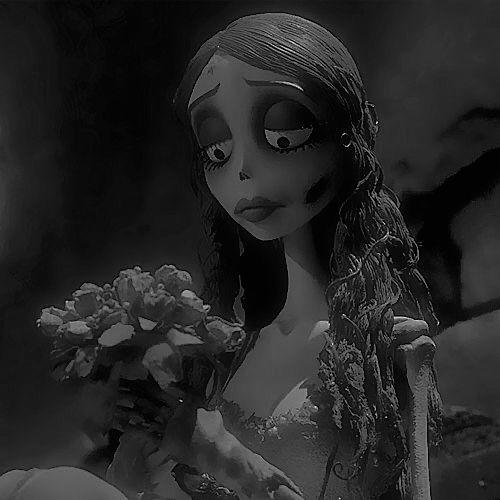 a creepy doll holding a bouquet of flowers in front of a dark background with light coming from behind it