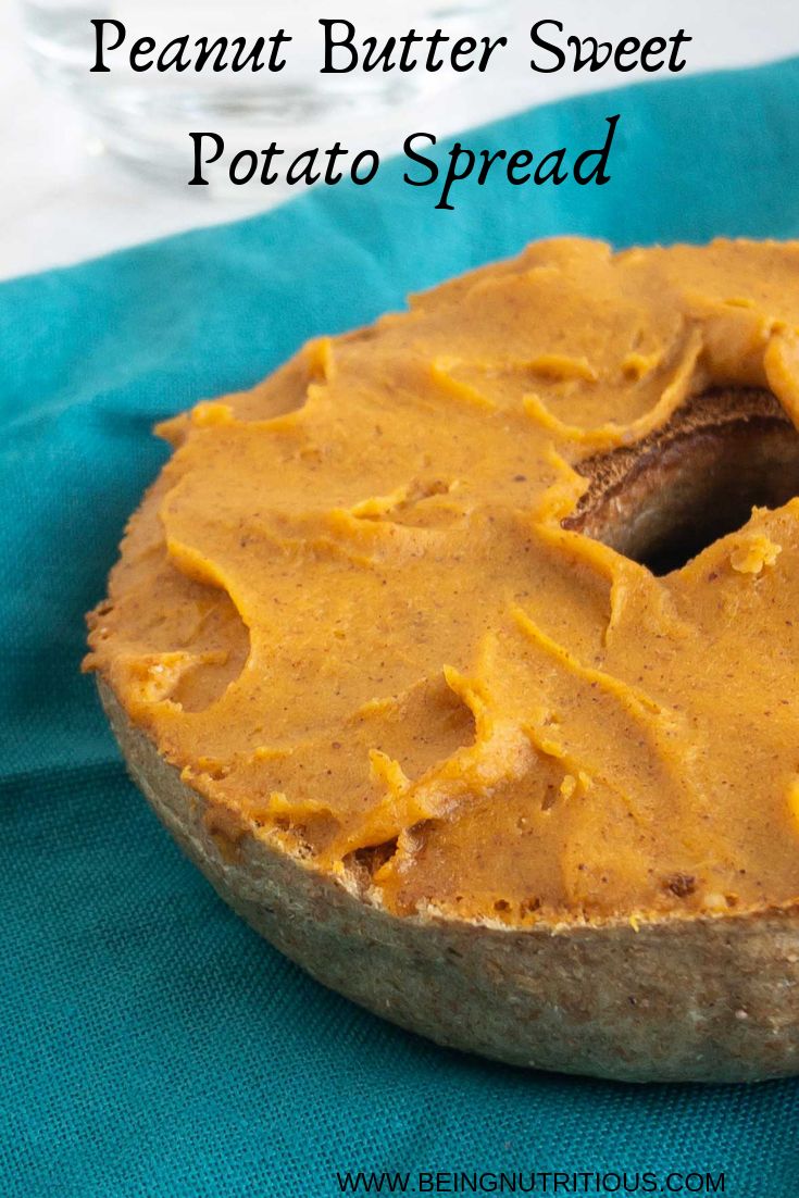 a close up of a doughnut on a blue cloth with the words peanut butter sweet potato spread