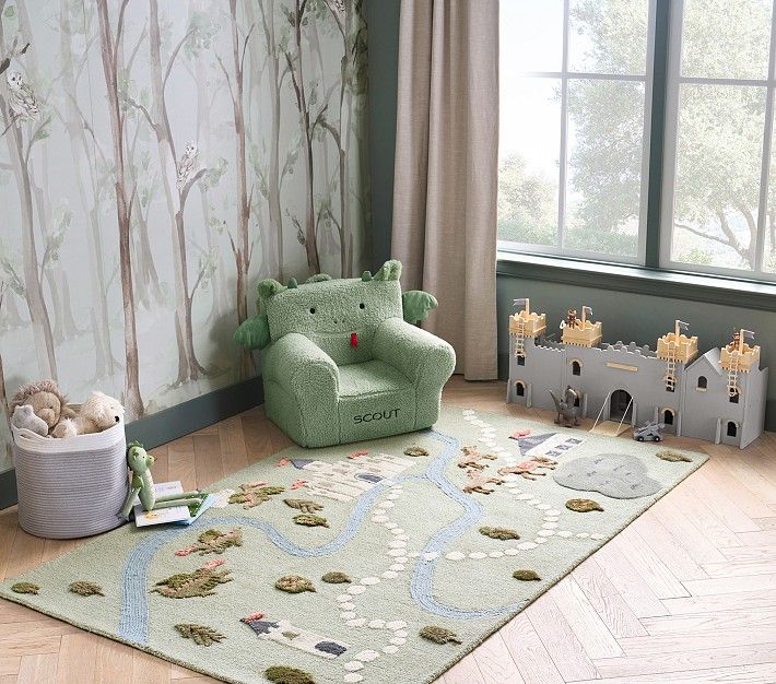 a child's room with green furniture and wallpaper, including a teddy bear chair