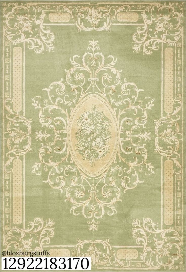 a green rug with an ornate design on it