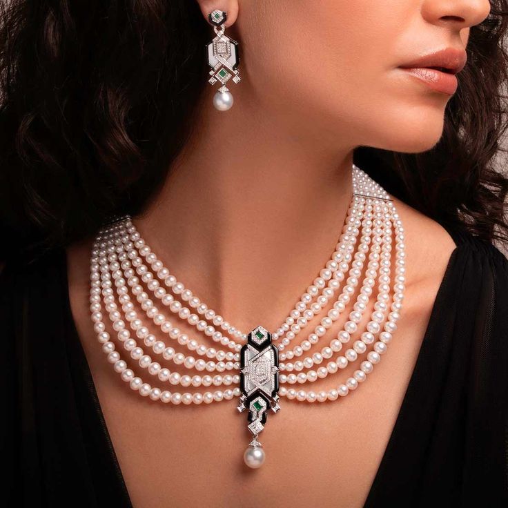 These unique piece is part of the brand new Cleopatra Collection, celebrating the mysterious intrigue of ancient Egypt. Crafted to perfection, this necklace features a diamond, onyx and emerald centerpiece, from which delicate layers of pearls elegantly drape. Anchoring the design is a beautiful Australian South Sea pearl.  Pair with the matching earrings for a flawless look. Pearl Size: 11-12mmMetal: 18K White GoldApproximate Diamond Weight: 1.76ctsApproximate Emerald Weight: 0.54ctsApproximate Onyx Weight: 0.54cts Diamond Emerald Necklace, Rare Pearls, Pearl Jewellery, Yoko London, Necklace Craft, Sea Pearl, Emerald Necklace, South Sea Pearls, Pearl Types