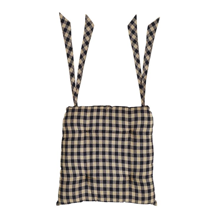 a black and white checkered bag with two ties hanging from it's sides