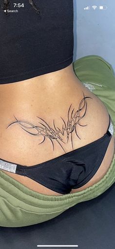 a woman with a tattoo on her stomach